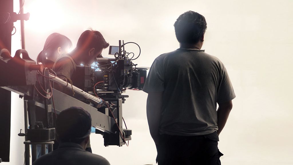 Video production shooting. Professional camera and film crew team in studio